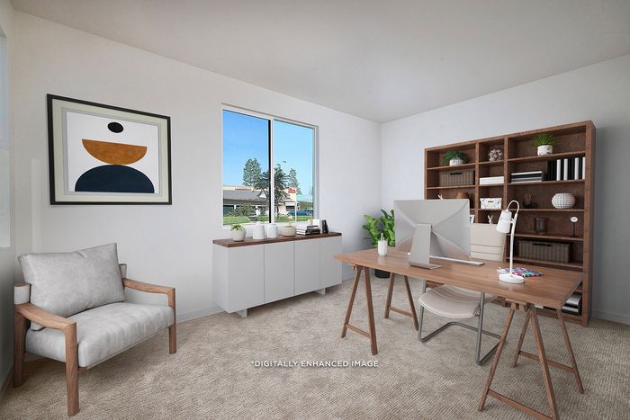 Virtually staged home office with carpeting