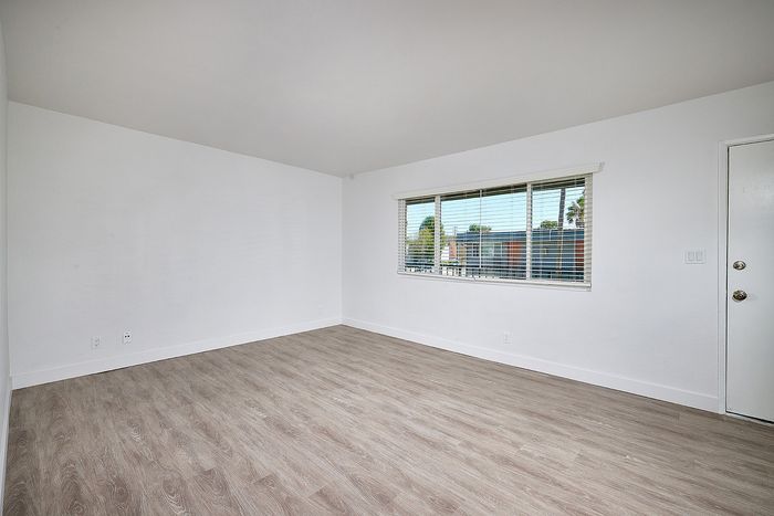 living room with wood-like flooring at Elivia