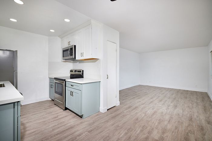 kitchen and dining area with wood-like flooring at Elivia