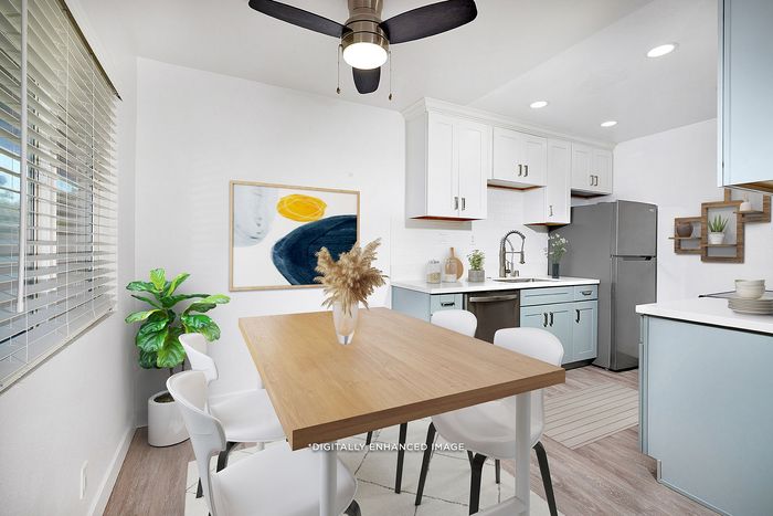 Virtually staged dining area and kitchen