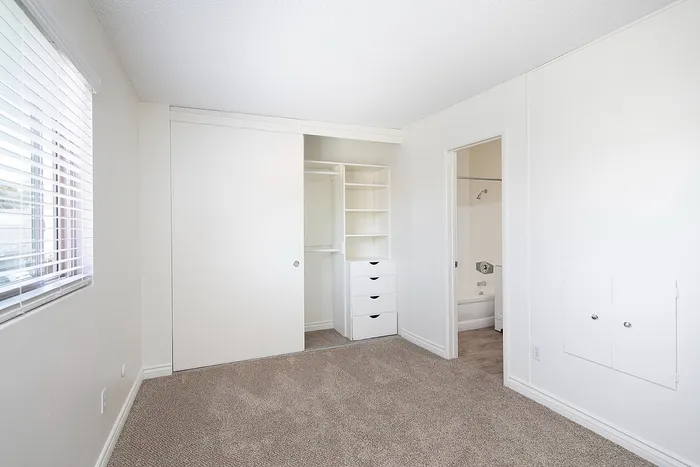 bedroom with sliding closet doors at Avaz Pacific Beach