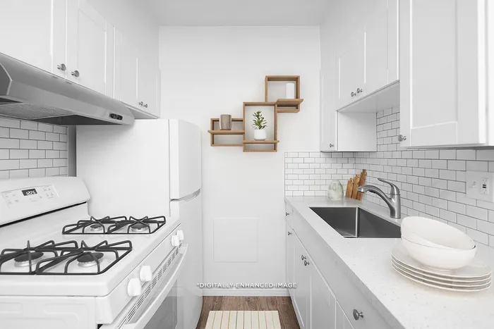 virtually staged kitchen with quartz countertops, farmhouse style sink, and updated cabinets