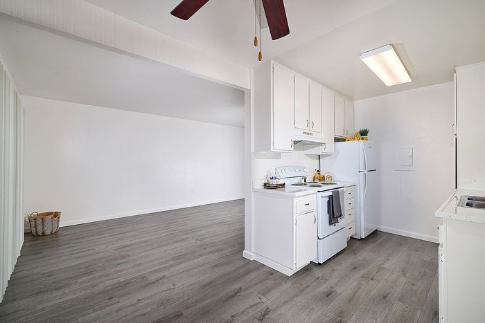 kitchen and living room with wood-like flooring at Canyon Park