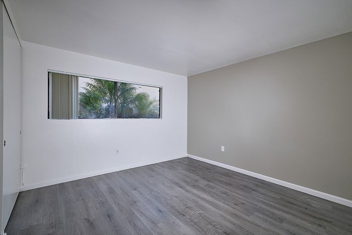 bedroom with wood-like flooring at Canyon Park