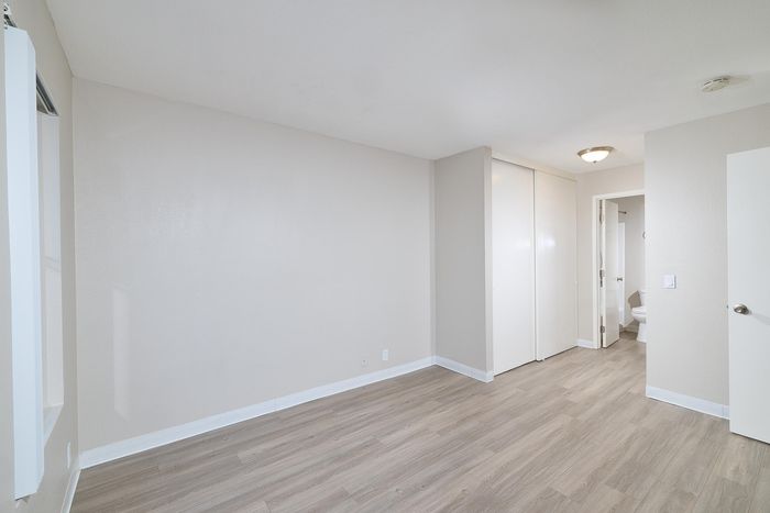 Bedroom with wooden floors
