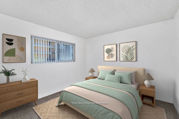 Virtually staged bedroom at Pine Vista with a bed, dresser and rug