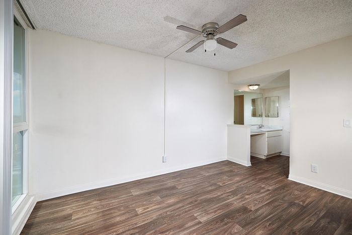 dining area with ceiling fan and wood-like flooring at mellmanor