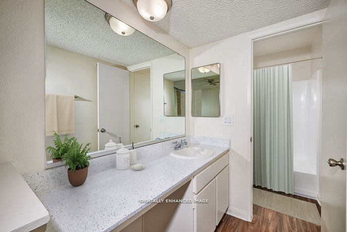 Virtually Staged Image - Ensuite bathroom with plenty of counterspace and shower