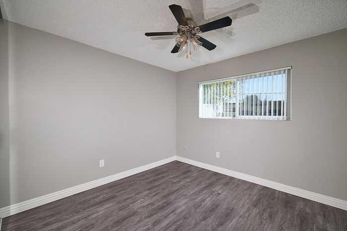 Spacious bedroom with ceiling fan,