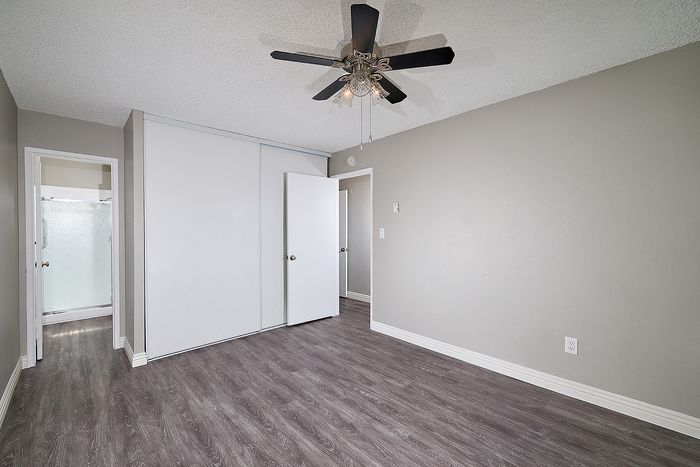 Spacious bedroom with ceiling fan