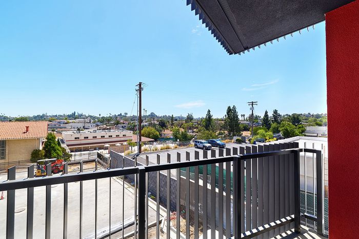View of the La Mesa, California landscape and distant hillsides from a private textur apartment balcony.
