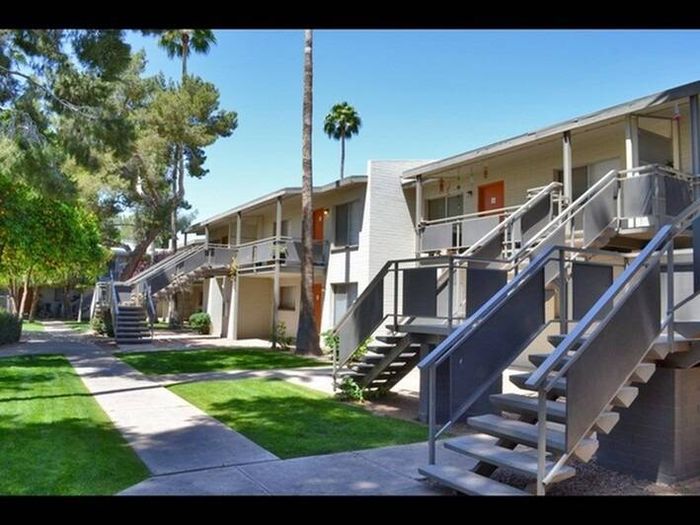 walkway and 2 story apartment building with stairs to second floor at Solaris on University
