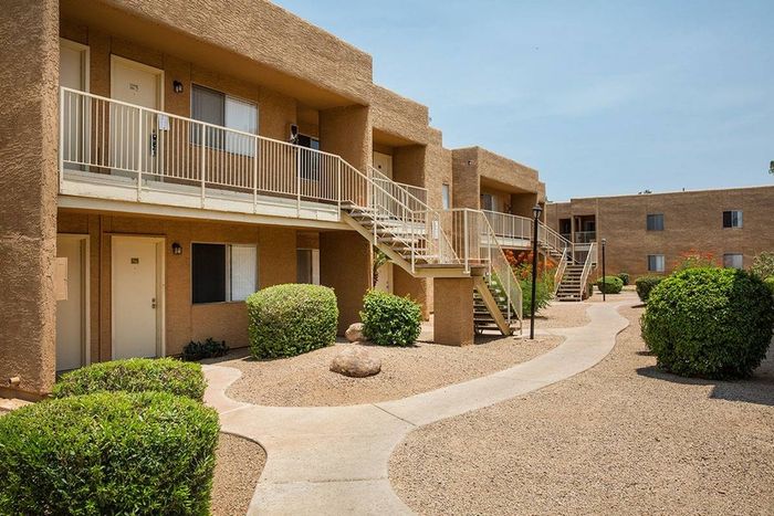 walkway to 2 story apartment buildings at Metro on Main