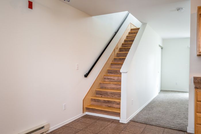 staircase with wooden flooring