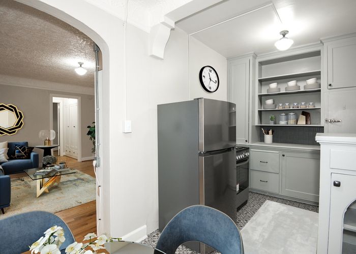 Virtually staged kitchen, dining and living area