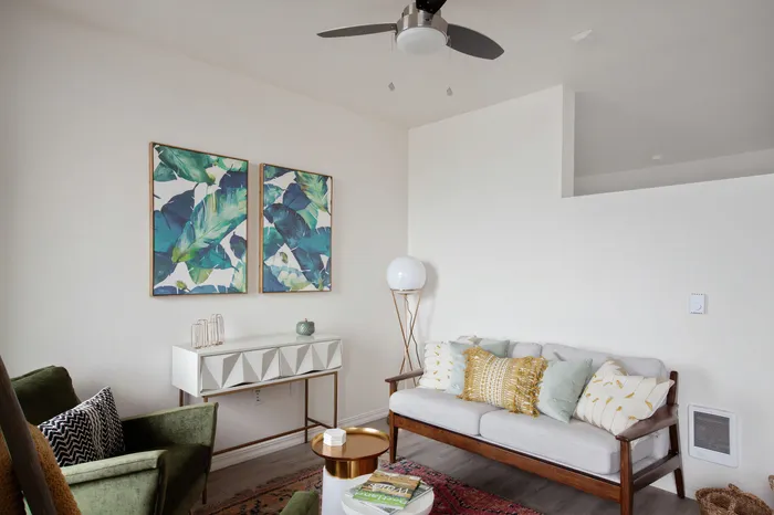 Living room with luxury vinyl plank flooring and ceiling fan