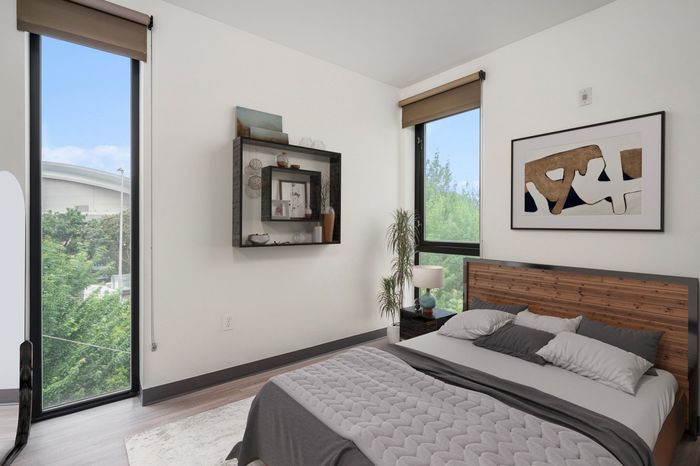 bedroom with queen size bed and two windows