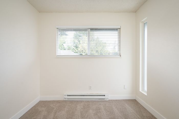 bedroom with carpet and sliding door closet