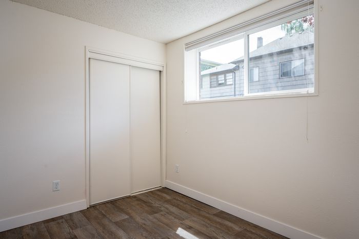 bedroom with carpet and sliding door closet