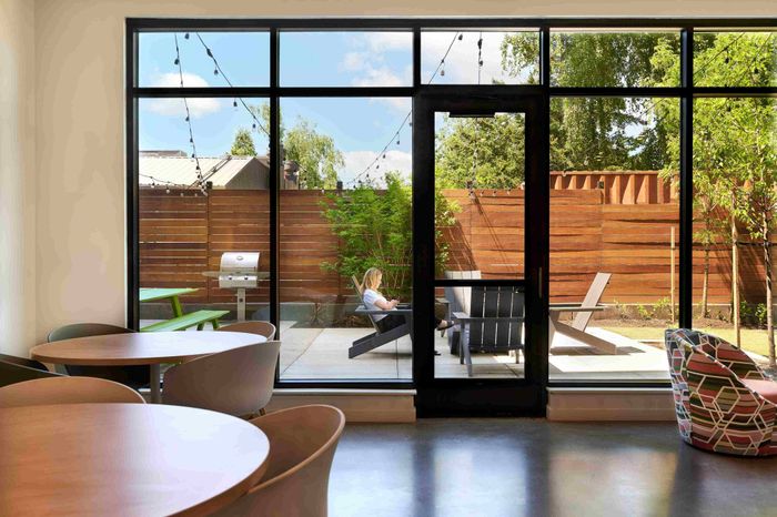 Community lounge area with outdoor seating, fire pit, and bbq area