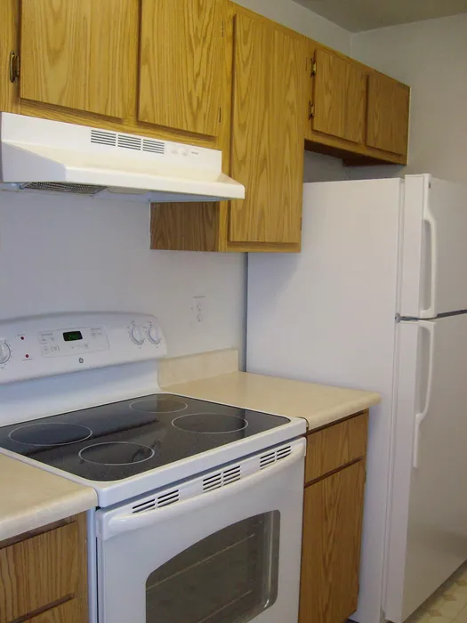 kitchen with white appliances at brooktree apartments