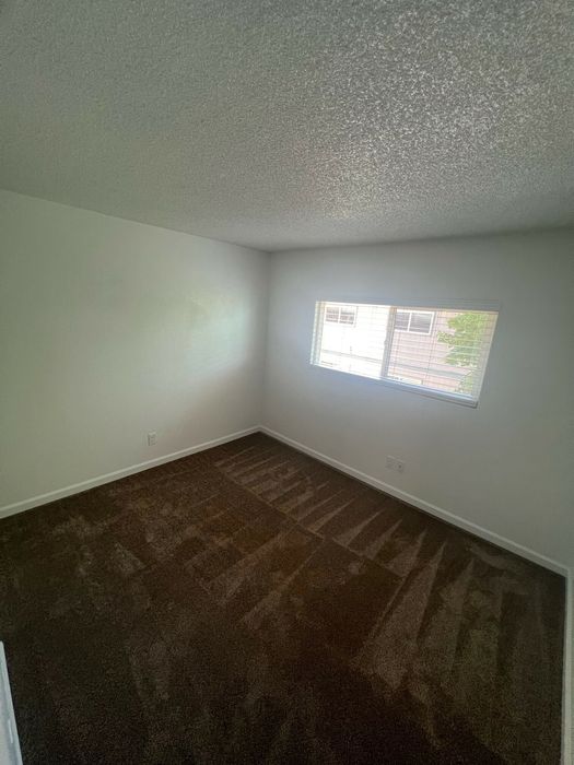 bedroom with brown carpet at the creek at south carson