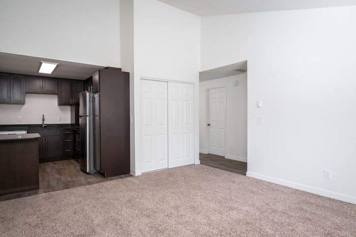 view of living room and kitchen and partial hallway