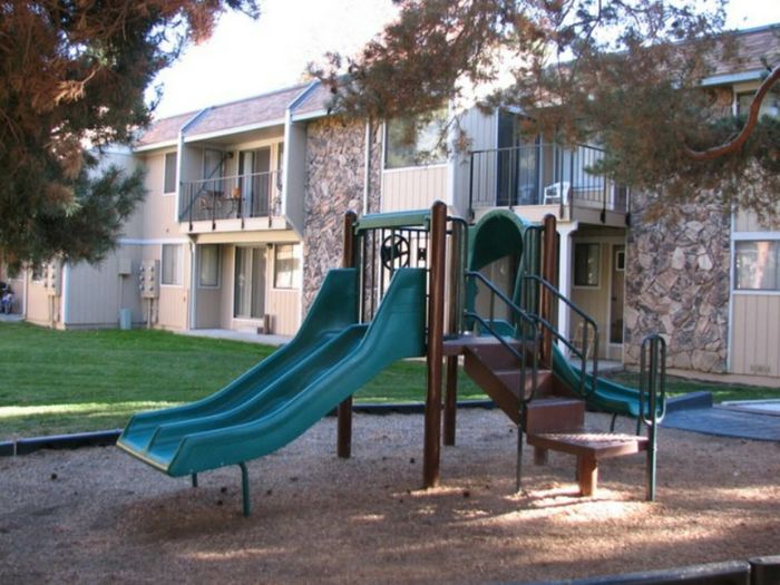 community playground and 2 story apartment building at ala moana