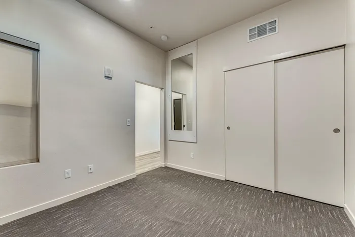 carpeted bedroom at oner midtown