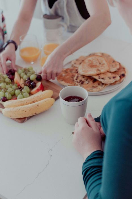 two people having coffee and breakfast