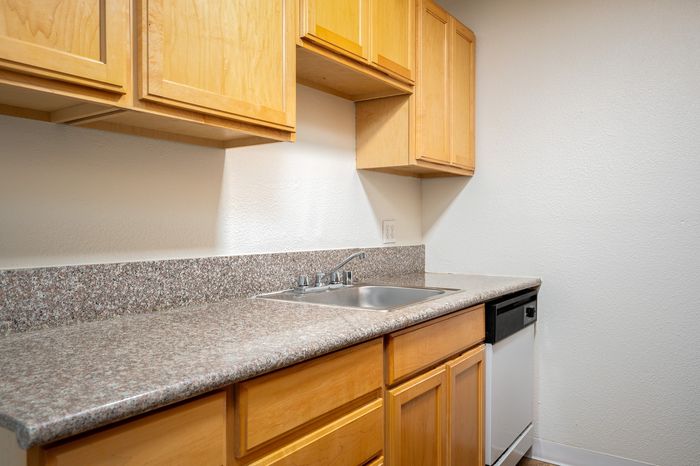 Kitchen with granite countertops and stainless steel sink