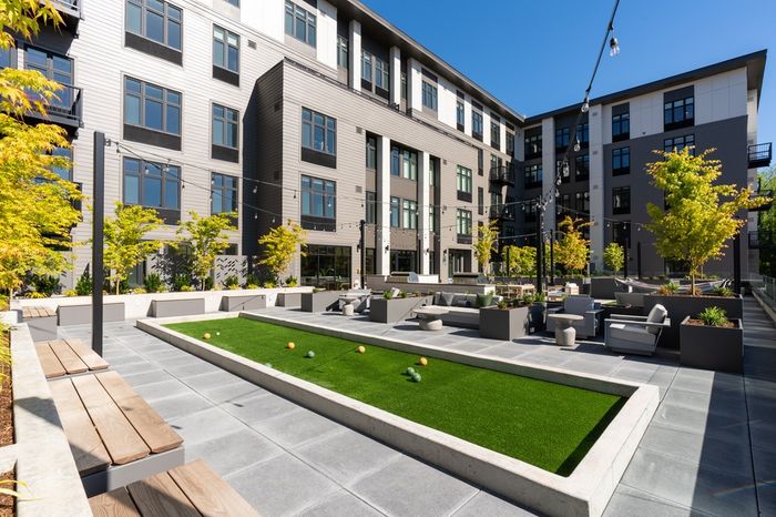 Outdoor community patio with bocce court at Henley Place