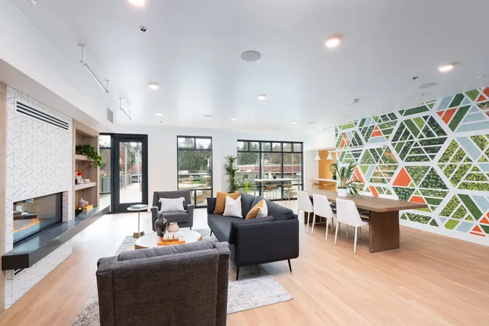 Clubroom with fireplace and sofas for residents