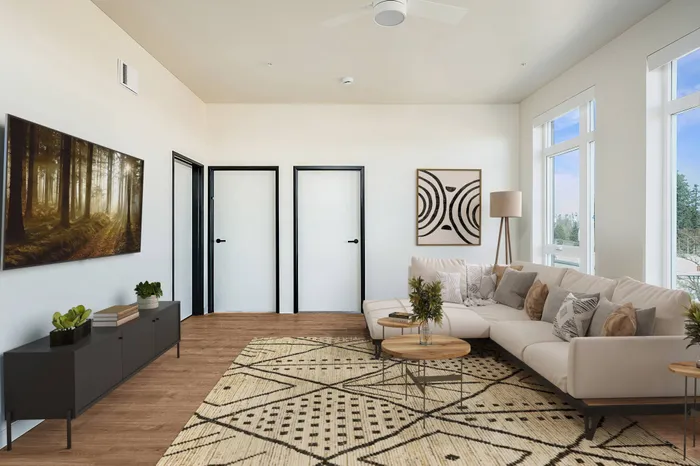 Spacious living room with large windows and abundant natural light and luxury vinyl plank flooring