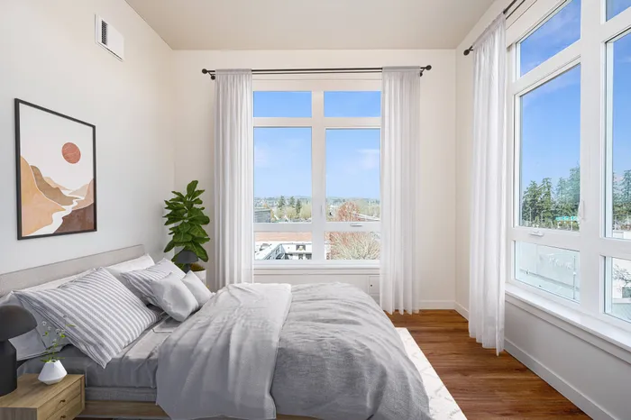 virtually staged bedroom with oversized windows adding to the natural light