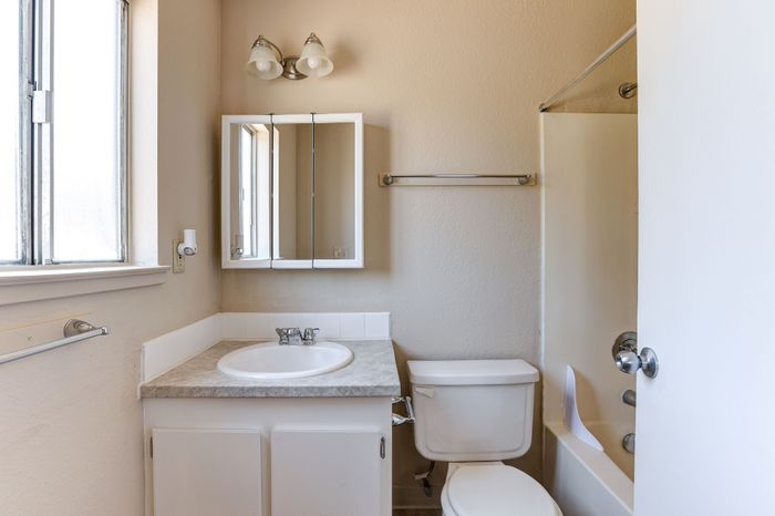 Bathroom with sink, shower, and toilet