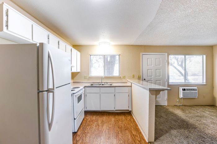 Full kitchen with fridge, oven and sink