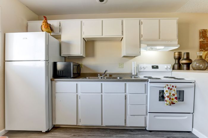 Full kitchen with fridge, oven and sink