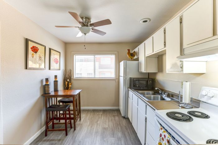 Full kitchen with fridge, oven and sink