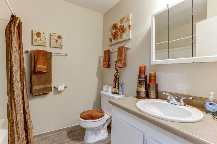 Bahtroom with sink, shower, and toilet