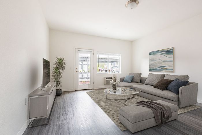 virtually staged Living Room with wood like flooring at Fernhill