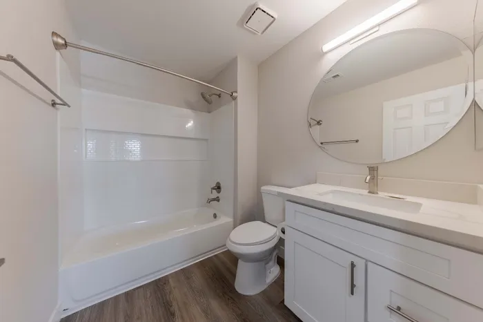 Bathroom with tub, shower, toilet, and sink