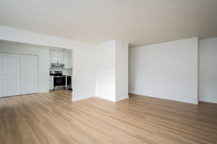 living room with attached kitchen and pantry