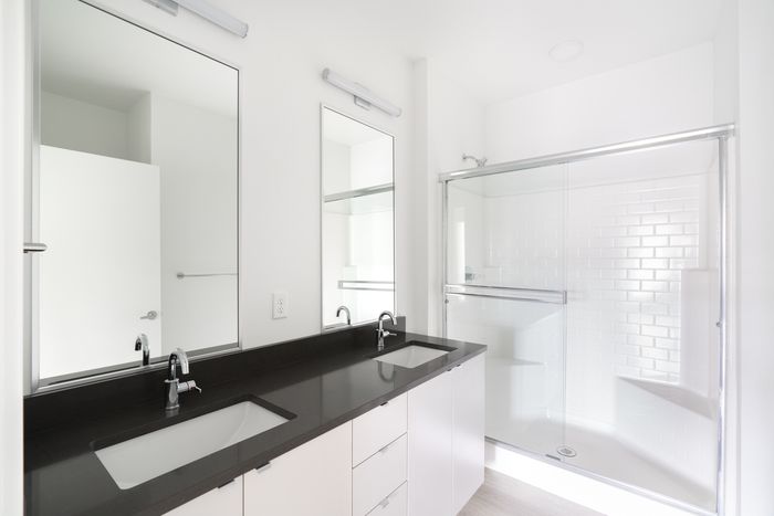 Bathroom with double vanity and walk in shower