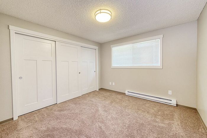 bedroom with large sliding door closets
