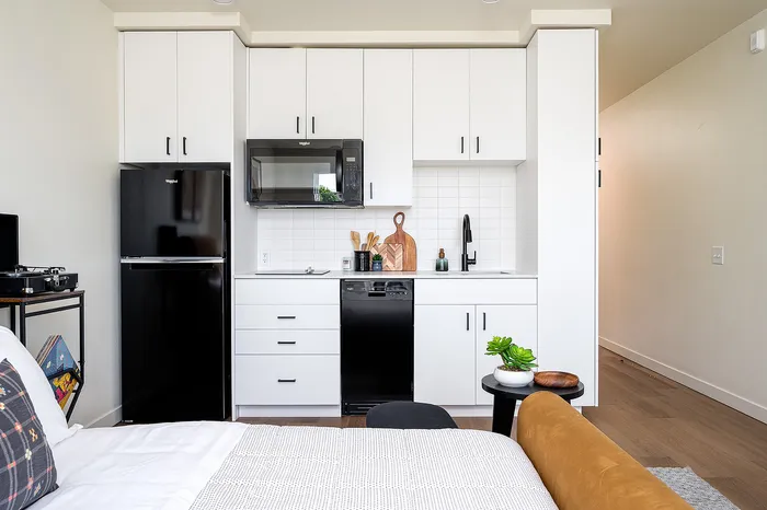 Furnished studio apartment home with in-home washer and dryer at Paceline in North Portland, Oregon