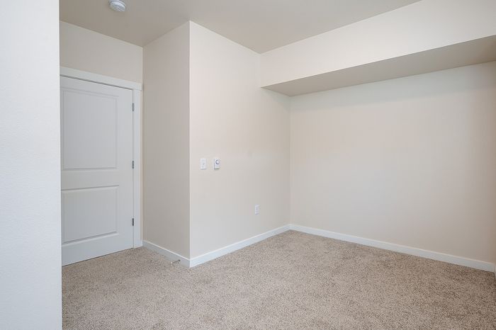 Bedroom with carpeted flooring