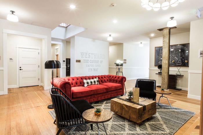 lounge area and fireplace in lobby at fairmount apartments