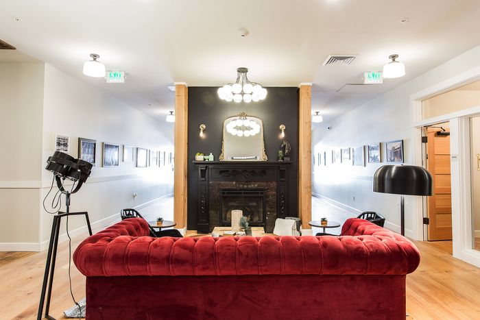 lounge area and fireplace in lobby at fairmount apartments