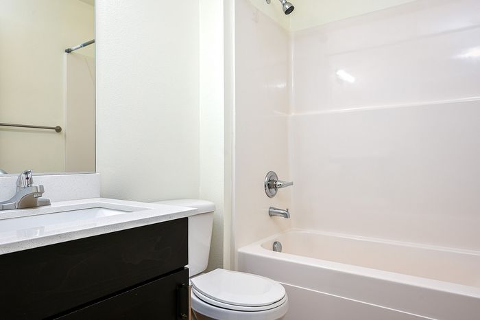bathroom with shower and tub